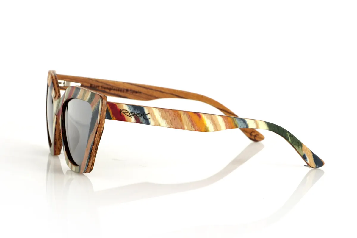 Wood eyewear of Zebrano PAI. PAI wooden sunglasses are made from laminated skateboard wood, with a multi-coloured finish that highlights their distinctive design. Their layered structure highlights natural textures, combining a striking front with a zebrawood interior that provides an elegant contrast.

The butterfly-shaped design offers a bold and original silhouette, balancing style and comfort. Thanks to their laminated wood construction, they are resistant and light, ideal for daily use.

The high-quality polarised lenses fully protect against UV rays and reduce glare, providing a clearer and more comfortable vision. A different proposal within the wooden glasses collection, connecting design and natural materials.

Dimensions 144x50 mm. Caliber 53 for Wholesale & Retail | Root Sunglasses® 
