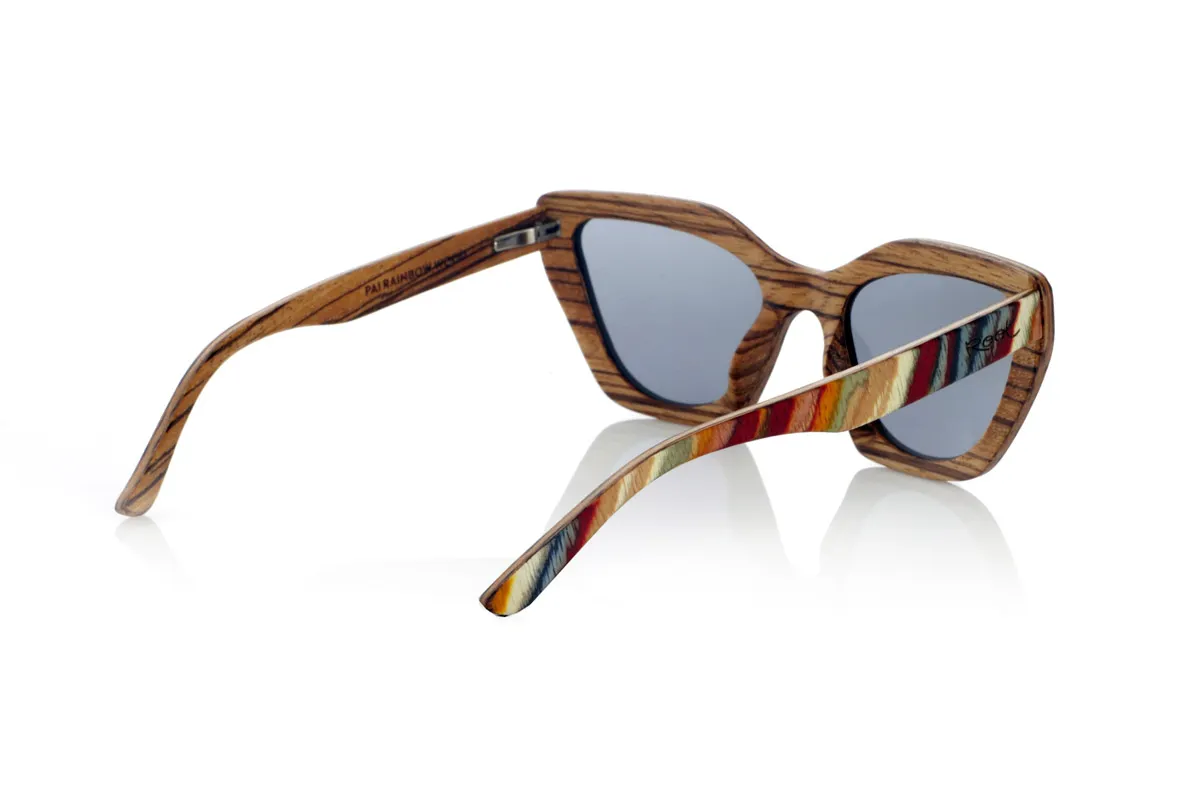 Wood eyewear of Zebrano PAI. PAI wooden sunglasses are made from laminated skateboard wood, with a multi-coloured finish that highlights their distinctive design. Their layered structure highlights natural textures, combining a striking front with a zebrawood interior that provides an elegant contrast.

The butterfly-shaped design offers a bold and original silhouette, balancing style and comfort. Thanks to their laminated wood construction, they are resistant and light, ideal for daily use.

The high-quality polarised lenses fully protect against UV rays and reduce glare, providing a clearer and more comfortable vision. A different proposal within the wooden glasses collection, connecting design and natural materials.

Dimensions 144x50 mm. Caliber 53 for Wholesale & Retail | Root Sunglasses® 