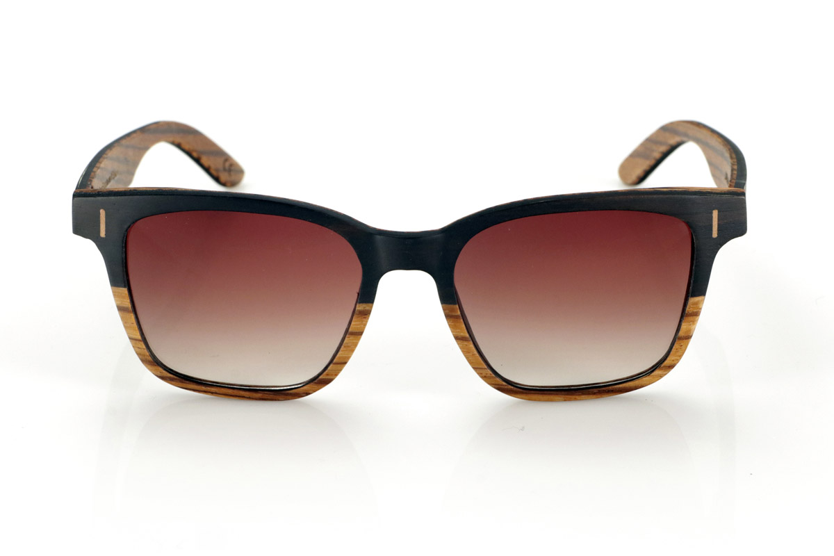 Wood eyewear of mpingo LOREA. LOREA sunglasses are manufactured in a combination of two woods, Mpingo (African Black wood) on top of the frame and on the outside of the temples and Zebrano on the bottom of the frame and inside of the temples. It is a simple and elegant easy-to-wear model with a very careful finish that will surprise you with its originality and the combination of woods. Front measurement: 145x50mm for Wholesale & Retail | Root Sunglasses® 