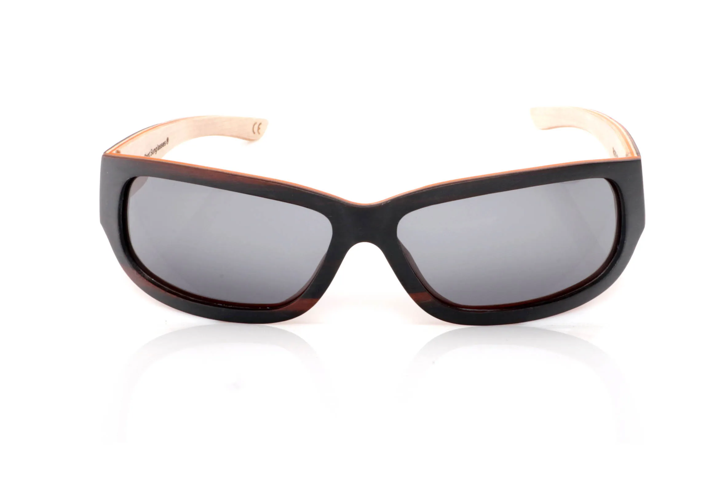 Wood eyewear of Ebony RIFF SK. RIFF wooden sunglasses feature an elongated, wrap-style design with a soft rectangular front that fits naturally to the face, giving them a modern and slightly sporty feel.

The contrast between the dark ebony exterior and the lighter inner wood creates a visually light yet strong piece. A balance between strength and natural aesthetics that defines the frame.

The temples continue this contrast, with an ergonomic shape that ensures comfort and stability for everyday wear.

Full UV protection.

Size: 145x42
Lens width: 62 for Wholesale & Retail | Root Sunglasses® 