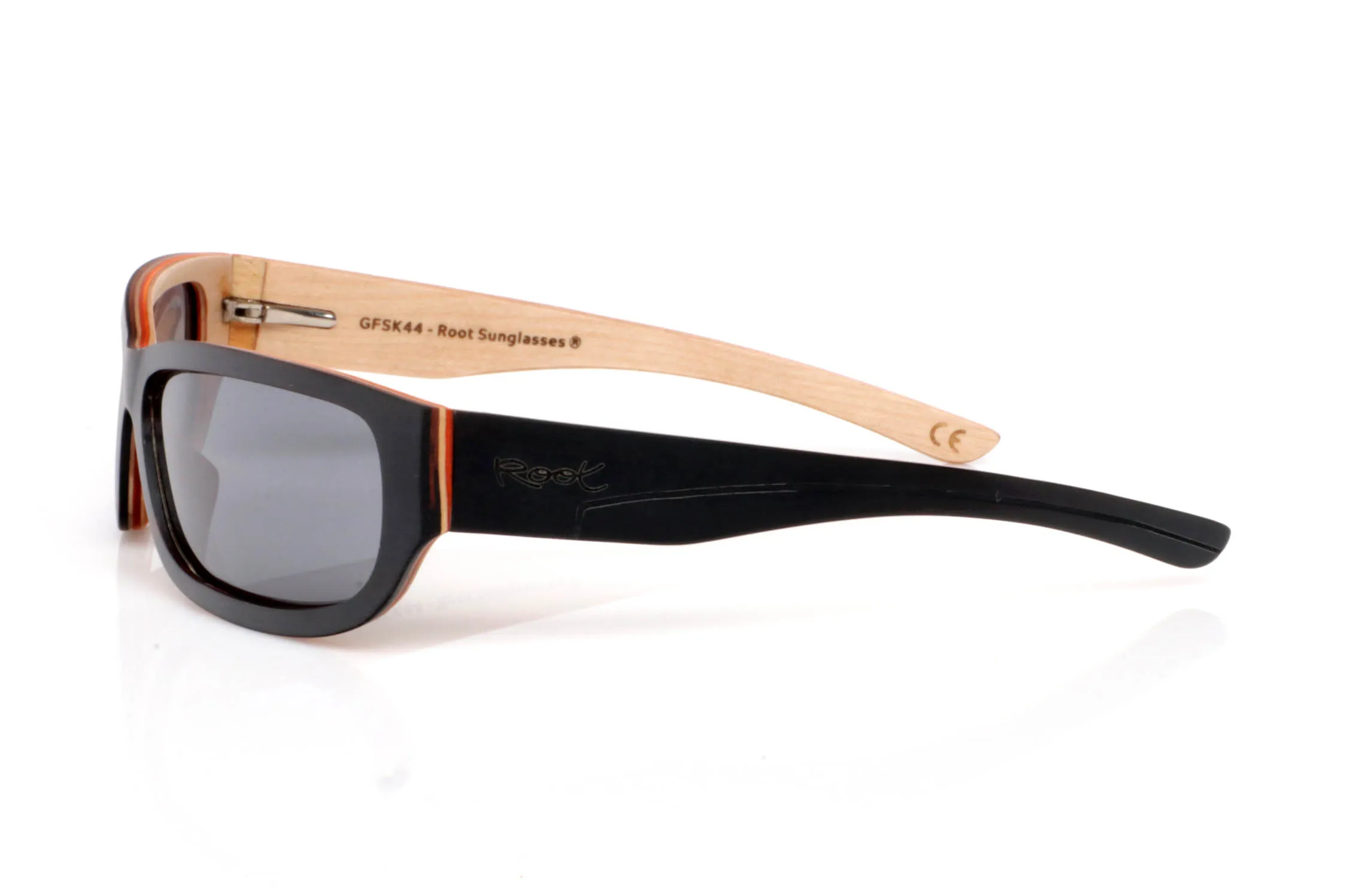Wood eyewear of Ebony RIFF SK. RIFF wooden sunglasses feature an elongated, wrap-style design with a soft rectangular front that fits naturally to the face, giving them a modern and slightly sporty feel.

The contrast between the dark ebony exterior and the lighter inner wood creates a visually light yet strong piece. A balance between strength and natural aesthetics that defines the frame.

The temples continue this contrast, with an ergonomic shape that ensures comfort and stability for everyday wear.

Full UV protection.

Size: 145x42
Lens width: 62 for Wholesale & Retail | Root Sunglasses® 