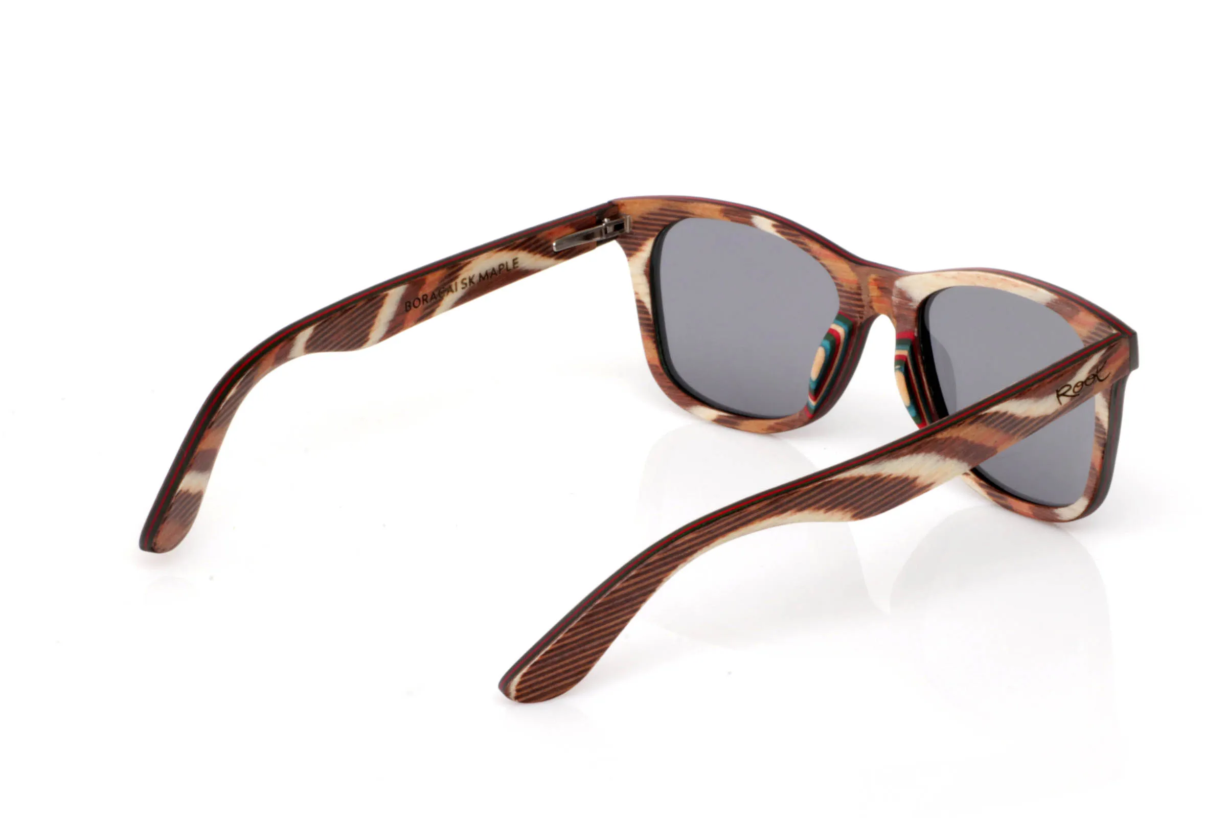 Wood eyewear of Maple BORACAI SK. BORACAI SK wooden sunglasses stand out for their textured front, blending earthy tones, cream and reddish hues into a warm, organic pattern. A design full of life where every piece feels unique.

The soft square shape keeps them balanced and easy to wear, while the maple finish enhances their natural and lightweight feel.

A frame with character, without being too bold. Natural, different, very Root.

Full UV protection.

Size: 142x48
Lens width: 52 for Wholesale & Retail | Root Sunglasses® 
