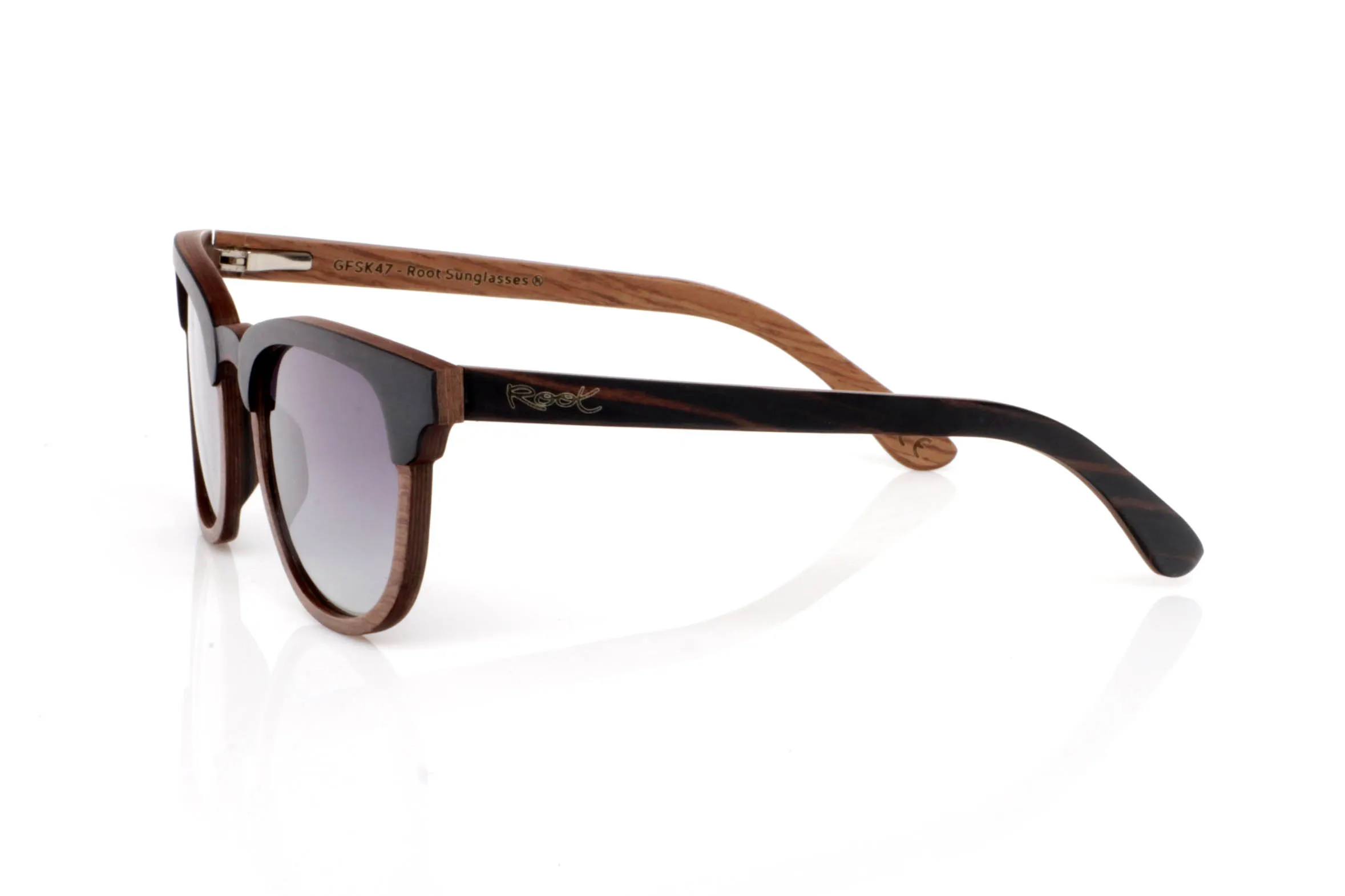 Wood eyewear of Ebony SOUNDY. SOUNDY wooden sunglasses stand out for their combination of dark ebony on the front and a lighter inner wood that adds contrast and warmth. A clean design with no excess, where the natural grain takes center stage and each piece feels unique.

The softly rounded shape makes them comfortable and easy to wear every day. They don’t try to stand out in an exaggerated way, but they have that subtle character you notice when you look closer.

Ebony brings visual strength and presence, while the overall finish keeps the lightweight feel of wood, making them comfortable for long use.

Full UV protection.

Size: 142x49
Lens width: 49 for Wholesale & Retail | Root Sunglasses® 