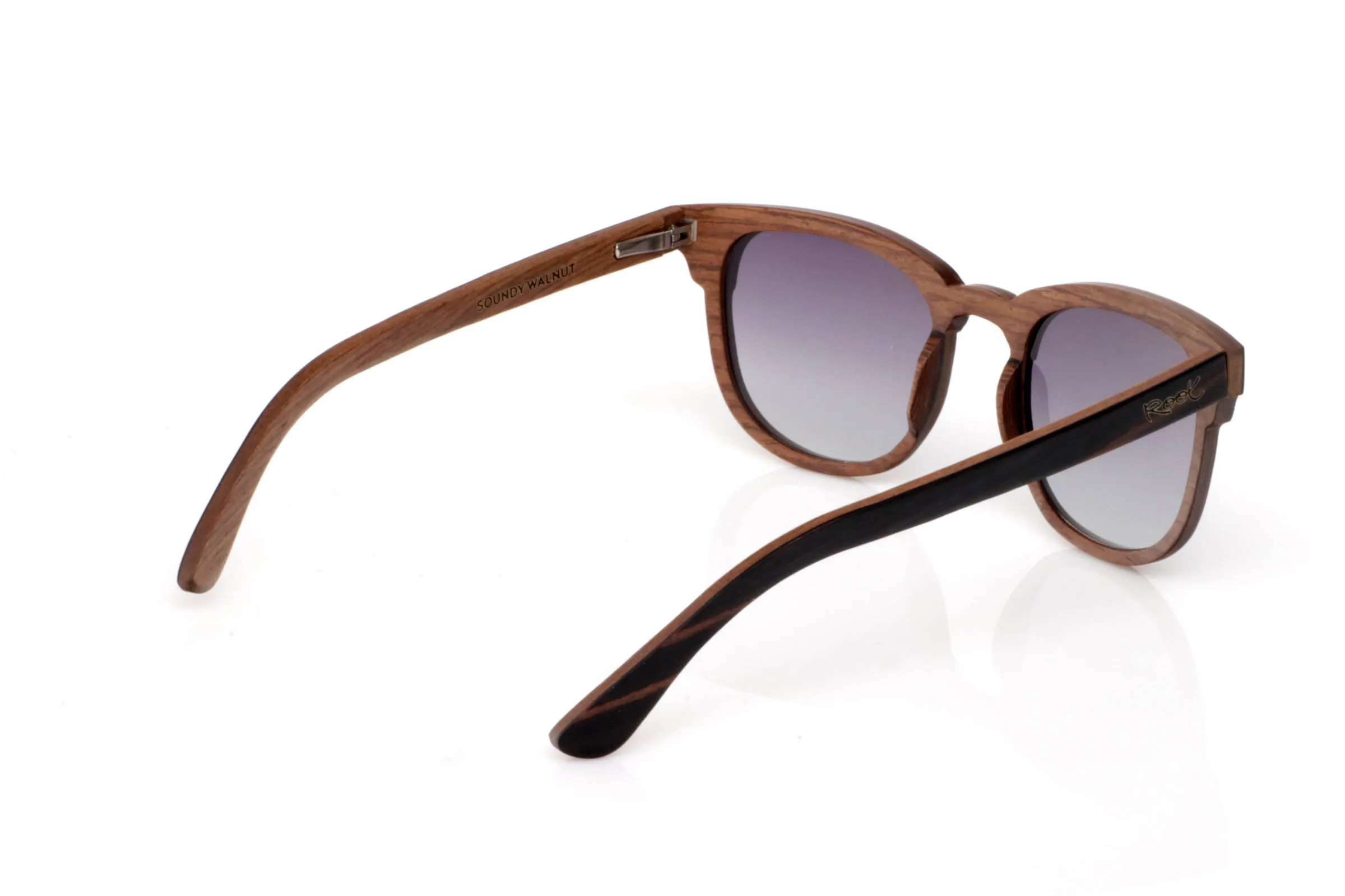 Wood eyewear of Ebony SOUNDY. SOUNDY wooden sunglasses stand out for their combination of dark ebony on the front and a lighter inner wood that adds contrast and warmth. A clean design with no excess, where the natural grain takes center stage and each piece feels unique.

The softly rounded shape makes them comfortable and easy to wear every day. They don’t try to stand out in an exaggerated way, but they have that subtle character you notice when you look closer.

Ebony brings visual strength and presence, while the overall finish keeps the lightweight feel of wood, making them comfortable for long use.

Full UV protection.

Size: 142x49
Lens width: 49 for Wholesale & Retail | Root Sunglasses® 