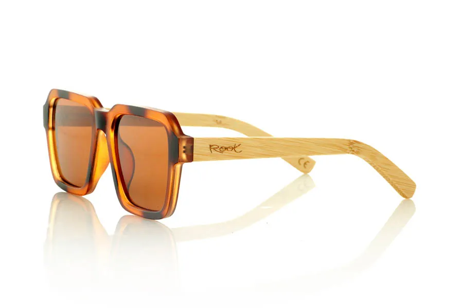Wood eyewear of Bamboo DANA. DANA Sunglasses with solid bamboo temples and a matte Havana acetate front with matching lenses. A model with striking square shapes and a retro personality, ideal for those looking for a distinctive pair of wooden sunglasses with a distinctive character. Lightweight, durable, and with flat polarized lenses with UV protection for comfortable and safe vision. Measurements: 146 x 49 mm. Caliber 53. for Wholesale & Retail | Root Sunglasses® 