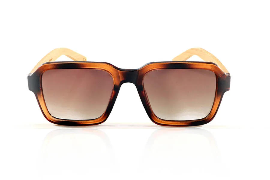 Wood eyewear of Bamboo DANA. DANA Sunglasses with solid bamboo temples and a matte Havana acetate front with matching lenses. A model with striking square shapes and a retro personality, ideal for those looking for a distinctive pair of wooden sunglasses with a distinctive character. Lightweight, durable, and with flat polarized lenses with UV protection for comfortable and safe vision. Measurements: 146 x 49 mm. Caliber 53. for Wholesale & Retail | Root Sunglasses® 
