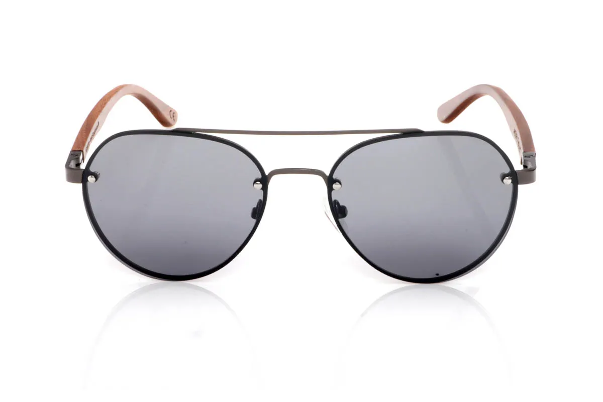Wood eyewear of Walnut BONIN ST. The BONIN ST sunglasses combine a clean metal front with the natural strength of walnut wood, creating a lightweight, honest and no-frills balance. The rounded shape, with an aviator feel, fits easily and brings a timeless sense of style.

The walnut wood temples make the difference. Visible grain, warm touch and an authentic feel you notice from the very first moment. They are comfortable, stable and full of character without effort. The kind of sunglasses that fit you without having to think about it.

Size: 145x50
Lens width: 54
 for Wholesale & Retail | Root Sunglasses® 