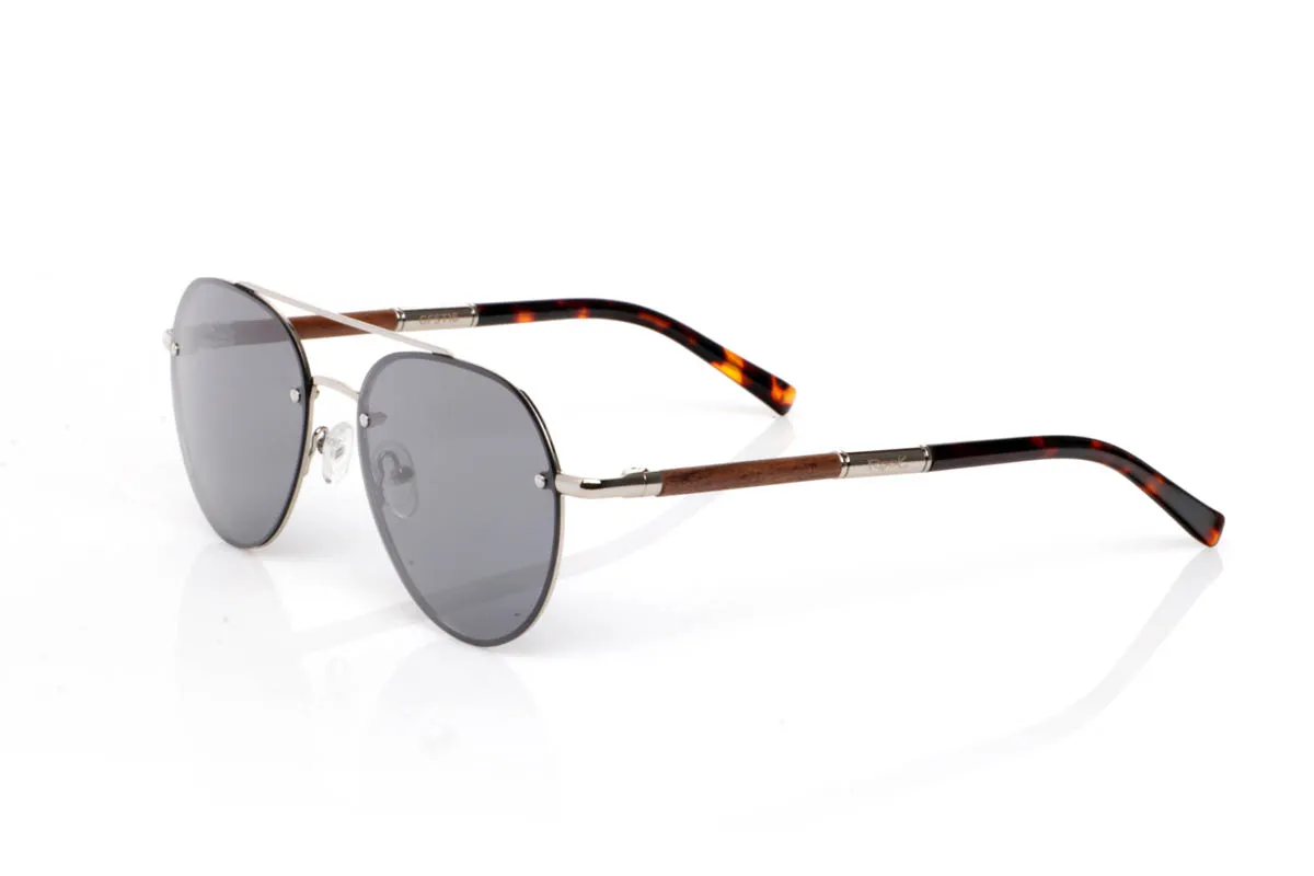 Wood eyewear of Walnut BONIN ST. The BONIN ST sunglasses combine a clean metal front with the natural strength of walnut wood, creating a lightweight, honest and no-frills balance. The rounded shape, with an aviator feel, fits easily and brings a timeless sense of style.

The walnut wood temples make the difference. Visible grain, warm touch and an authentic feel you notice from the very first moment. They are comfortable, stable and full of character without effort. The kind of sunglasses that fit you without having to think about it.

Size: 145x50
Lens width: 54
 for Wholesale & Retail | Root Sunglasses® 