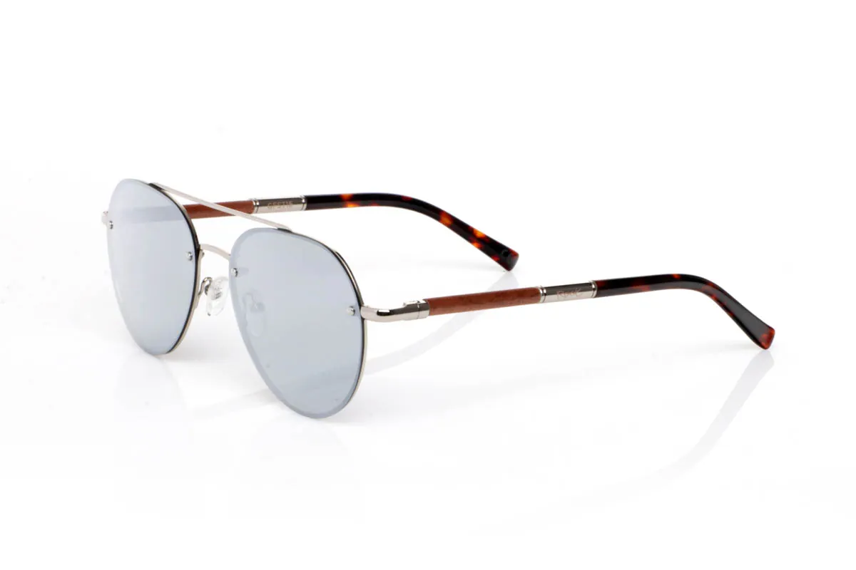 Wood eyewear of Walnut BONIN ST. The BONIN ST sunglasses combine a clean metal front with the natural strength of walnut wood, creating a lightweight, honest and no-frills balance. The rounded shape, with an aviator feel, fits easily and brings a timeless sense of style.

The walnut wood temples make the difference. Visible grain, warm touch and an authentic feel you notice from the very first moment. They are comfortable, stable and full of character without effort. The kind of sunglasses that fit you without having to think about it.

Size: 145x50
Lens width: 54
 for Wholesale & Retail | Root Sunglasses® 