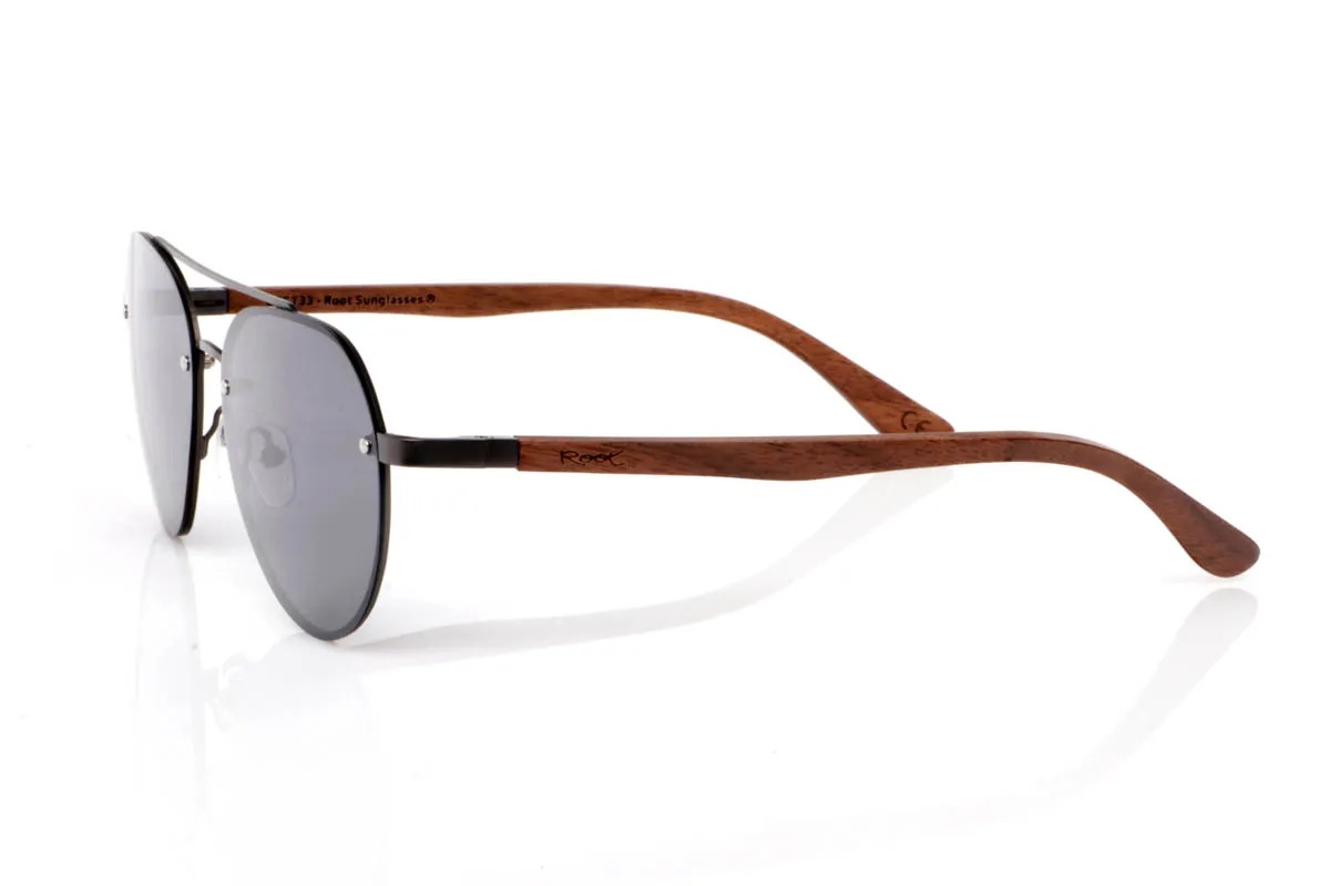 Wood eyewear of Walnut BONIN ST. The BONIN ST sunglasses combine a clean metal front with the natural strength of walnut wood, creating a lightweight, honest and no-frills balance. The rounded shape, with an aviator feel, fits easily and brings a timeless sense of style.

The walnut wood temples make the difference. Visible grain, warm touch and an authentic feel you notice from the very first moment. They are comfortable, stable and full of character without effort. The kind of sunglasses that fit you without having to think about it.

Size: 145x50
Lens width: 54
 for Wholesale & Retail | Root Sunglasses® 