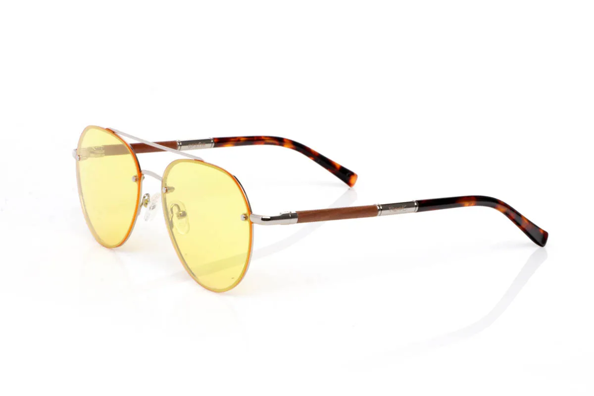 Wood eyewear of Walnut BONIN ST. The BONIN ST sunglasses combine a clean metal front with the natural strength of walnut wood, creating a lightweight, honest and no-frills balance. The rounded shape, with an aviator feel, fits easily and brings a timeless sense of style.

The walnut wood temples make the difference. Visible grain, warm touch and an authentic feel you notice from the very first moment. They are comfortable, stable and full of character without effort. The kind of sunglasses that fit you without having to think about it.

Size: 145x50
Lens width: 54
 for Wholesale & Retail | Root Sunglasses® 