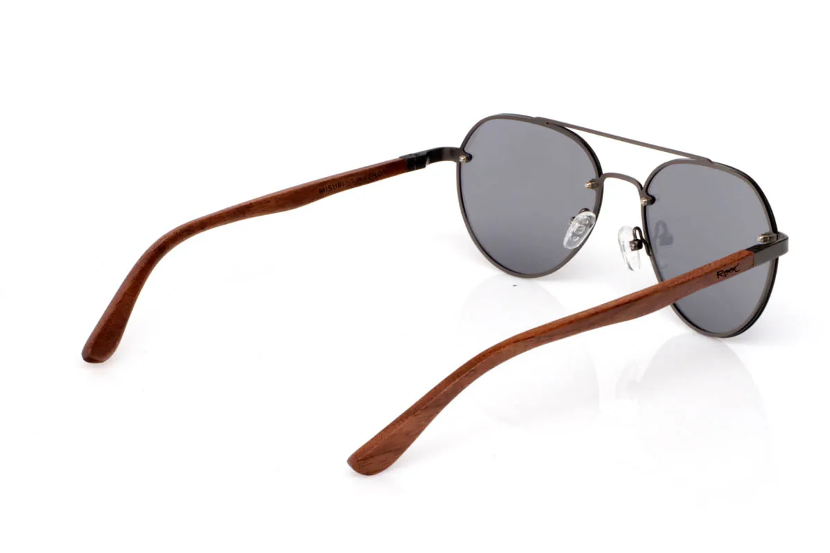 Wood eyewear of Walnut BONIN ST. The BONIN ST sunglasses combine a clean metal front with the natural strength of walnut wood, creating a lightweight, honest and no-frills balance. The rounded shape, with an aviator feel, fits easily and brings a timeless sense of style.

The walnut wood temples make the difference. Visible grain, warm touch and an authentic feel you notice from the very first moment. They are comfortable, stable and full of character without effort. The kind of sunglasses that fit you without having to think about it.

Size: 145x50
Lens width: 54
 for Wholesale & Retail | Root Sunglasses® 