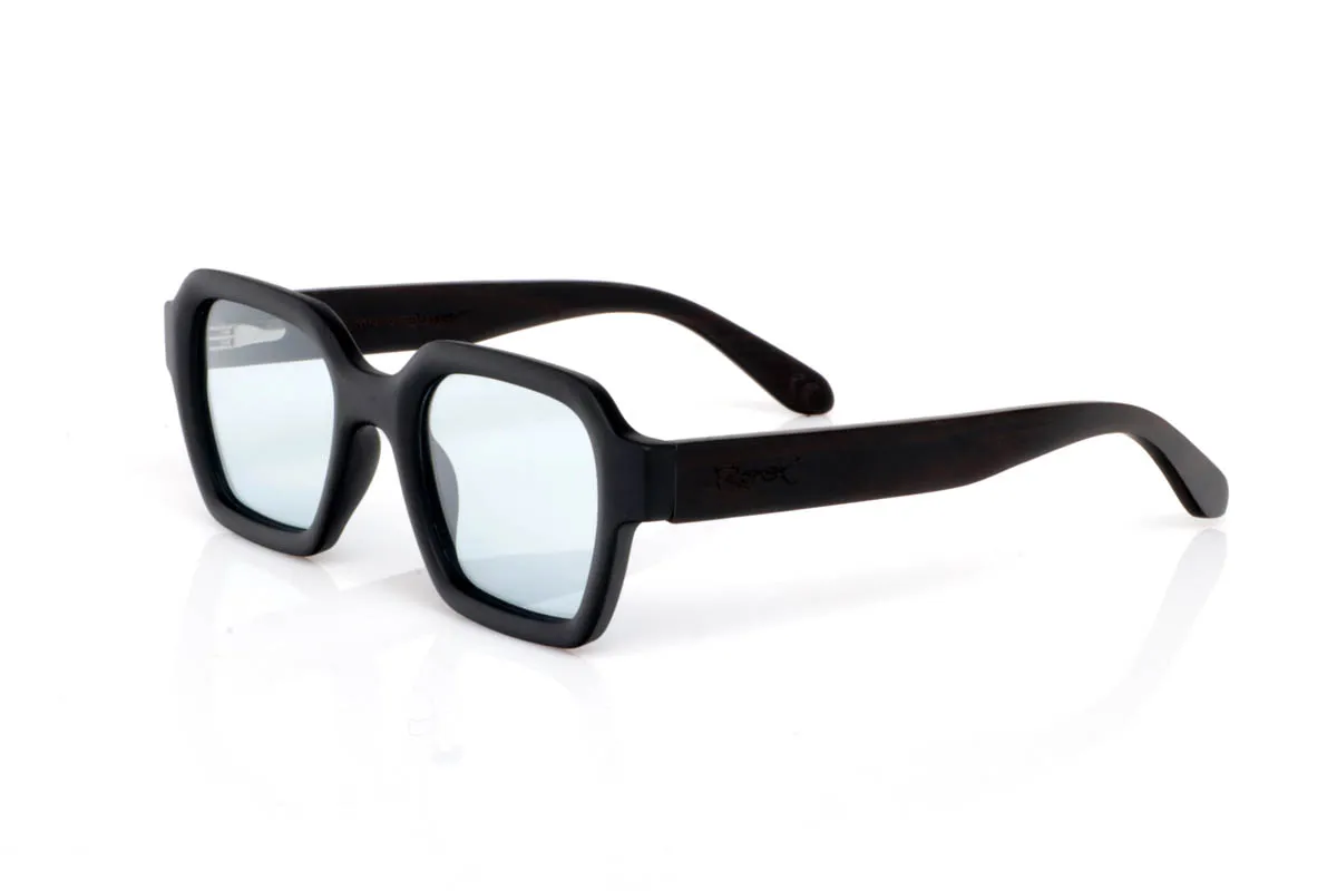 Wood eyewear of mpingo TRIMED. The TRIMED BLACK WOOD go for a more solid design, with a defined front and straight lines that add presence without losing balance. A soft square shape that structures the face and conveys character from the very first moment.

The Mpingo wood temples reinforce that natural feel, with visible grain and a finish that brings warmth against the stronger front. They are comfortable, stable and with a clear personality, made for those looking for something with more presence, without excess. You put them on and they define you.

Full UV protection.

Size: 142x49
Lens width: 48
 for Wholesale & Retail | Root Sunglasses® 