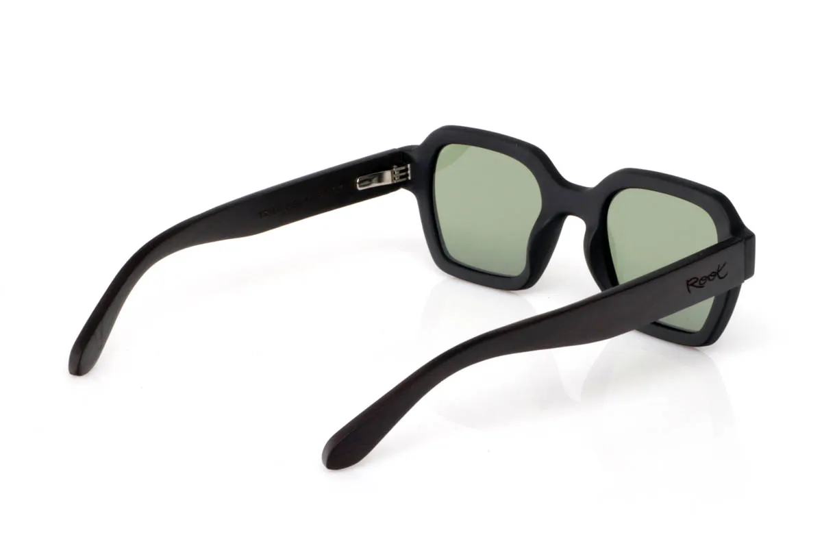 Wood eyewear of mpingo TRIMED. The TRIMED BLACK WOOD go for a more solid design, with a defined front and straight lines that add presence without losing balance. A soft square shape that structures the face and conveys character from the very first moment.

The Mpingo wood temples reinforce that natural feel, with visible grain and a finish that brings warmth against the stronger front. They are comfortable, stable and with a clear personality, made for those looking for something with more presence, without excess. You put them on and they define you.

Full UV protection.

Size: 142x49
Lens width: 48
 for Wholesale & Retail | Root Sunglasses® 