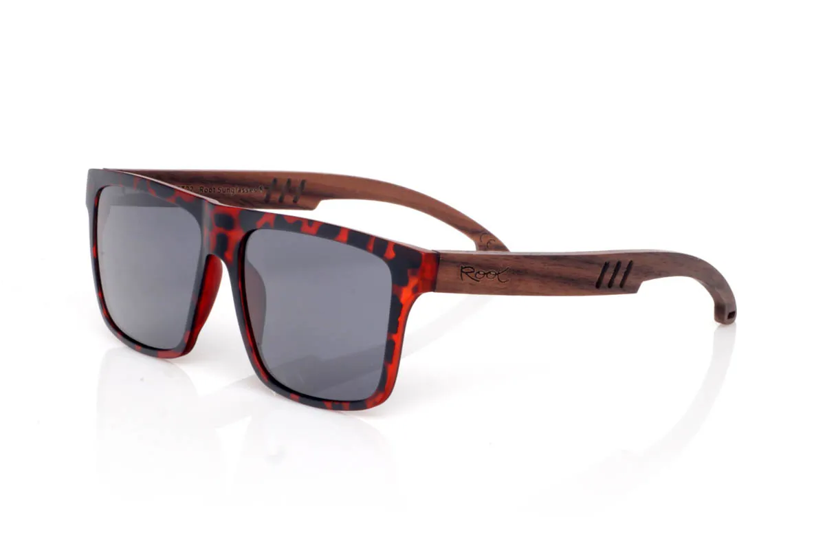 Wood eyewear of Walnut TRAP. The TRAP wooden sunglasses go for a square shape with character, featuring clean lines and balanced presence. A straightforward design, easy to wear, with a solid feel you notice from the very first moment.

The walnut wood temples bring warmth and authenticity, with visible grain and a natural touch that contrasts with the more defined front. They are comfortable, stable and full of character without effort. The kind of sunglasses that fit you without even trying.

Full UV protection.

Size: 142x50
Lens width: 54
 for Wholesale & Retail | Root Sunglasses® 