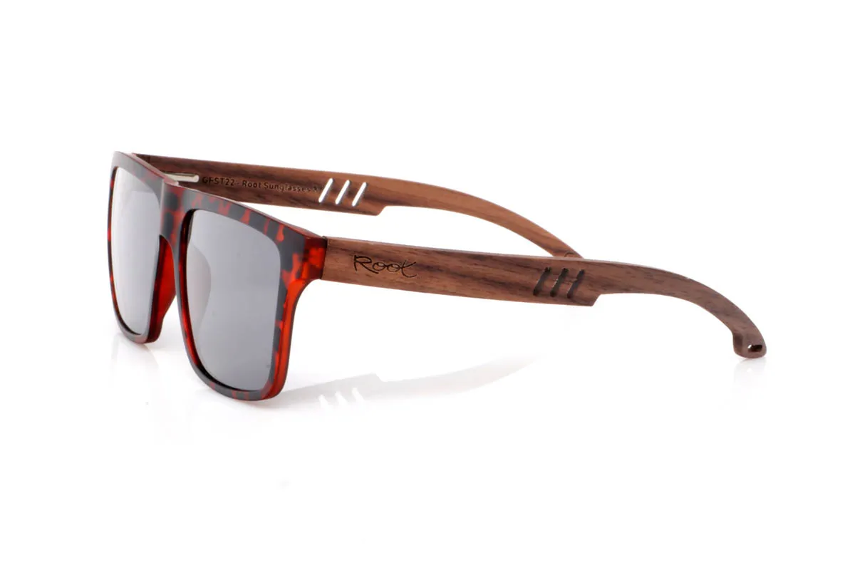 Wood eyewear of Walnut TRAP. The TRAP wooden sunglasses go for a square shape with character, featuring clean lines and balanced presence. A straightforward design, easy to wear, with a solid feel you notice from the very first moment.

The walnut wood temples bring warmth and authenticity, with visible grain and a natural touch that contrasts with the more defined front. They are comfortable, stable and full of character without effort. The kind of sunglasses that fit you without even trying.

Full UV protection.

Size: 142x50
Lens width: 54
 for Wholesale & Retail | Root Sunglasses® 