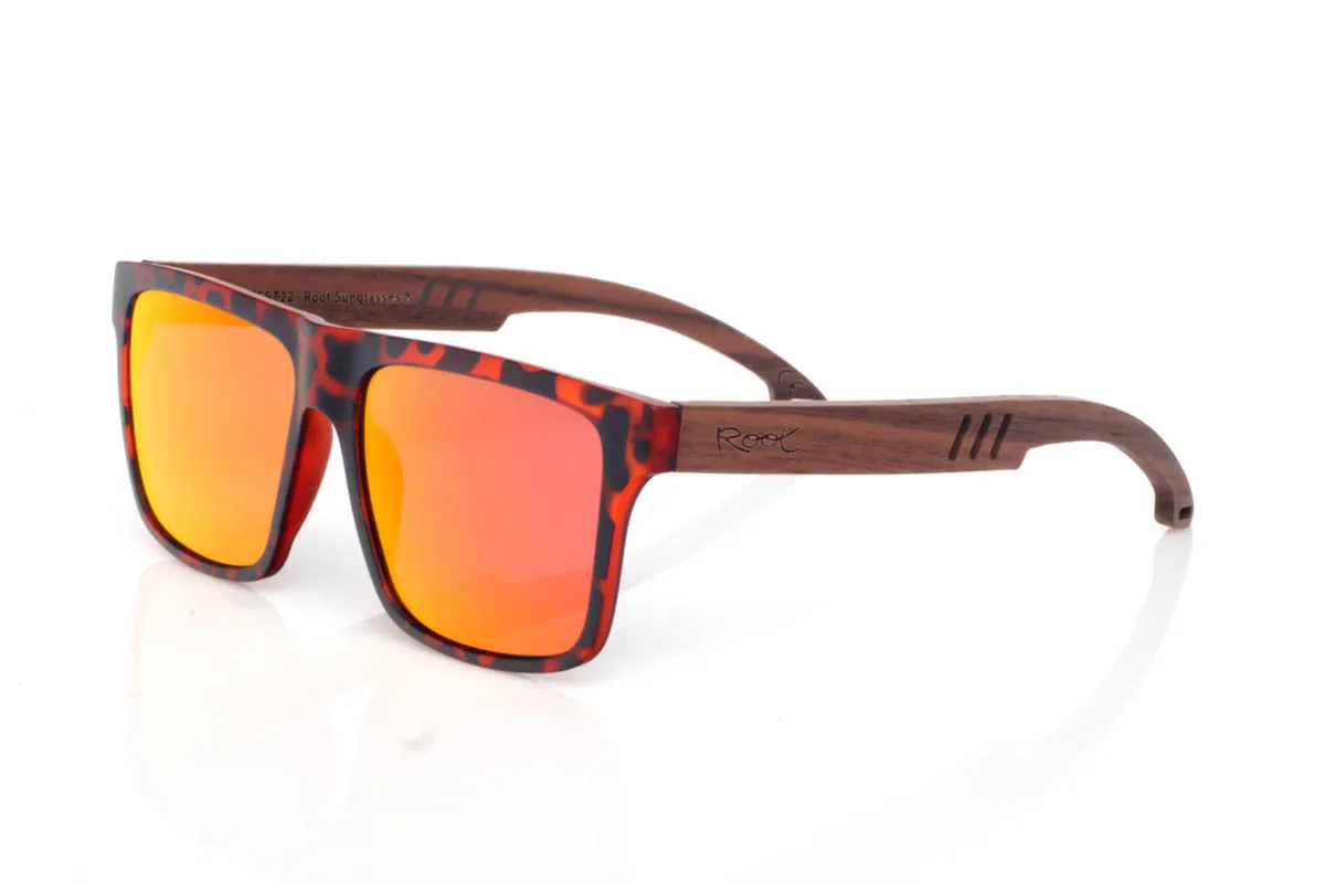 Wood eyewear of Walnut TRAP. The TRAP wooden sunglasses go for a square shape with character, featuring clean lines and balanced presence. A straightforward design, easy to wear, with a solid feel you notice from the very first moment.

The walnut wood temples bring warmth and authenticity, with visible grain and a natural touch that contrasts with the more defined front. They are comfortable, stable and full of character without effort. The kind of sunglasses that fit you without even trying.

Full UV protection.

Size: 142x50
Lens width: 54
 for Wholesale & Retail | Root Sunglasses® 