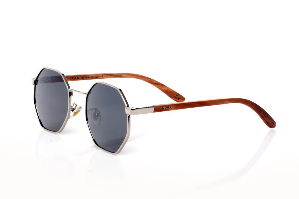 Wood eyewear of Zebrano DANAE. The DANAE ZEBRANO wooden sunglasses stand out for their balanced geometric shape, with a lightweight metal front that brings visual clarity and a contemporary feel. A design that sits between organic and structured, enhancing the face without feeling excessive, making them easy to wear every day.

The zebrano wood temples add character and texture, with a distinctive grain that creates a unique and natural visual effect. The contrast between metal and wood reinforces their personality while keeping them lightweight and comfortable. The kind of sunglasses that add style without trying too hard.

Full UV protection.

Size: 140x50
Lens width: 53 for Wholesale & Retail | Root Sunglasses® 