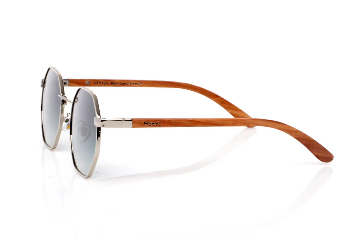 Wood eyewear of Zebrano DANAE. The DANAE ZEBRANO wooden sunglasses stand out for their balanced geometric shape, with a lightweight metal front that brings visual clarity and a contemporary feel. A design that sits between organic and structured, enhancing the face without feeling excessive, making them easy to wear every day.

The zebrano wood temples add character and texture, with a distinctive grain that creates a unique and natural visual effect. The contrast between metal and wood reinforces their personality while keeping them lightweight and comfortable. The kind of sunglasses that add style without trying too hard.

Full UV protection.

Size: 140x50
Lens width: 53 for Wholesale & Retail | Root Sunglasses® 