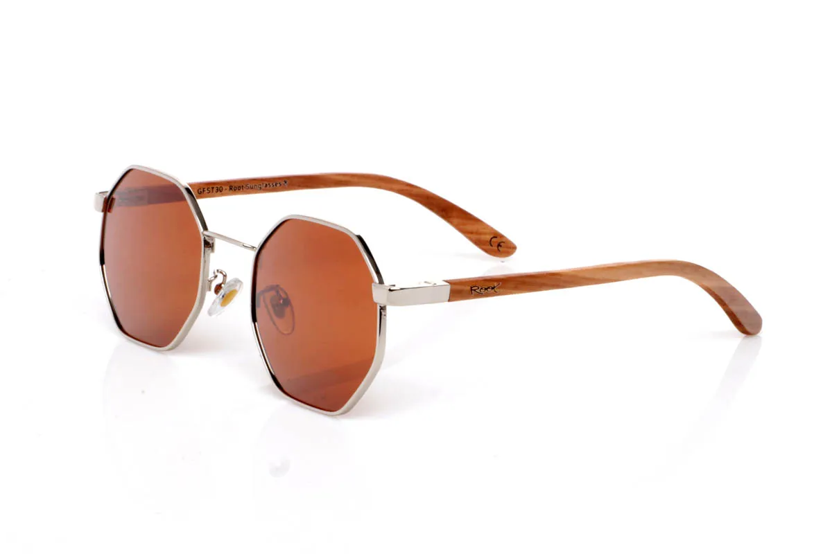 Wood eyewear of Zebrano DANAE. The DANAE ZEBRANO wooden sunglasses stand out for their balanced geometric shape, with a lightweight metal front that brings visual clarity and a contemporary feel. A design that sits between organic and structured, enhancing the face without feeling excessive, making them easy to wear every day.

The zebrano wood temples add character and texture, with a distinctive grain that creates a unique and natural visual effect. The contrast between metal and wood reinforces their personality while keeping them lightweight and comfortable. The kind of sunglasses that add style without trying too hard.

Full UV protection.

Size: 140x50
Lens width: 53 for Wholesale & Retail | Root Sunglasses® 